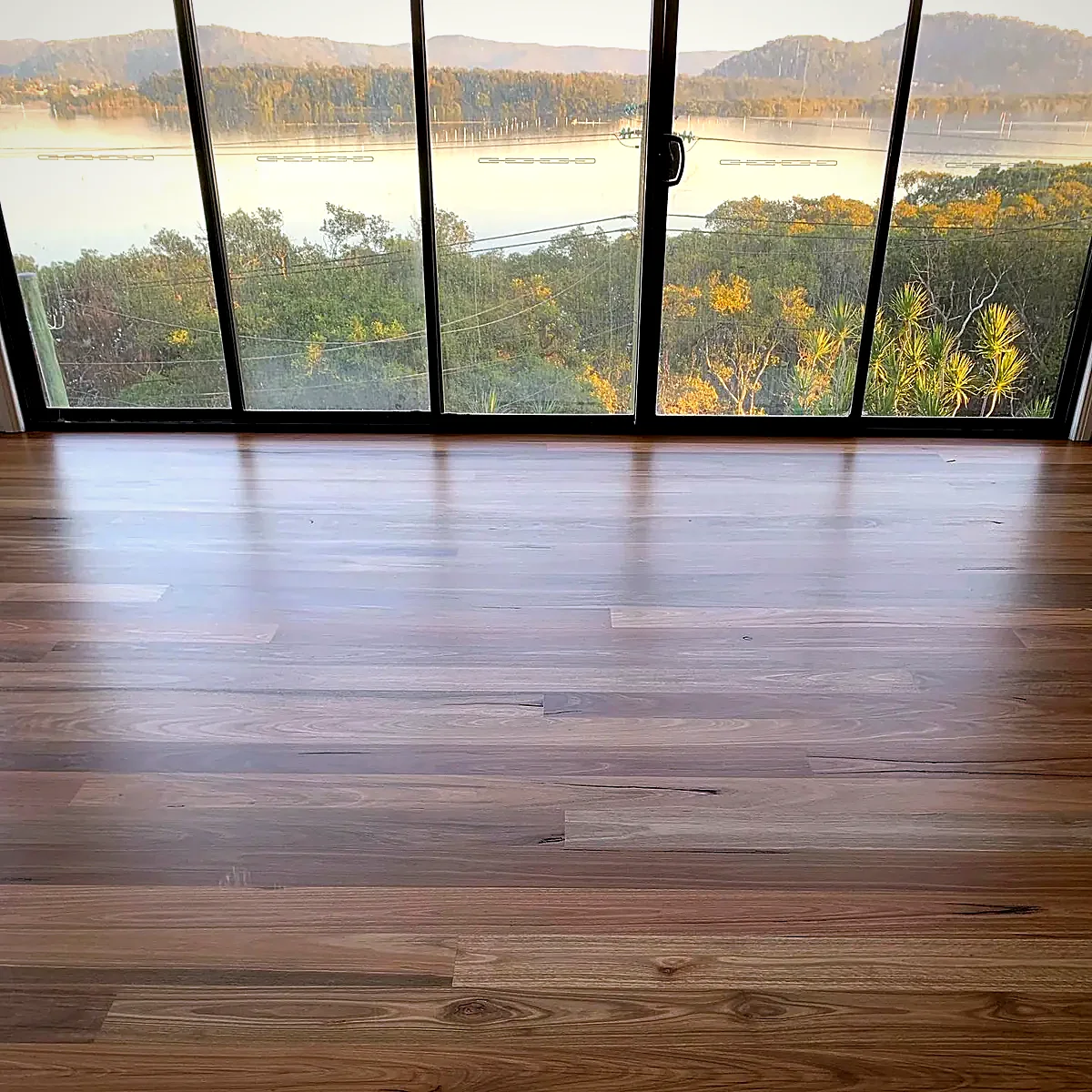 Spotted Gum floor sanded and polished with water views, Bona finish by Select Timber Flooring