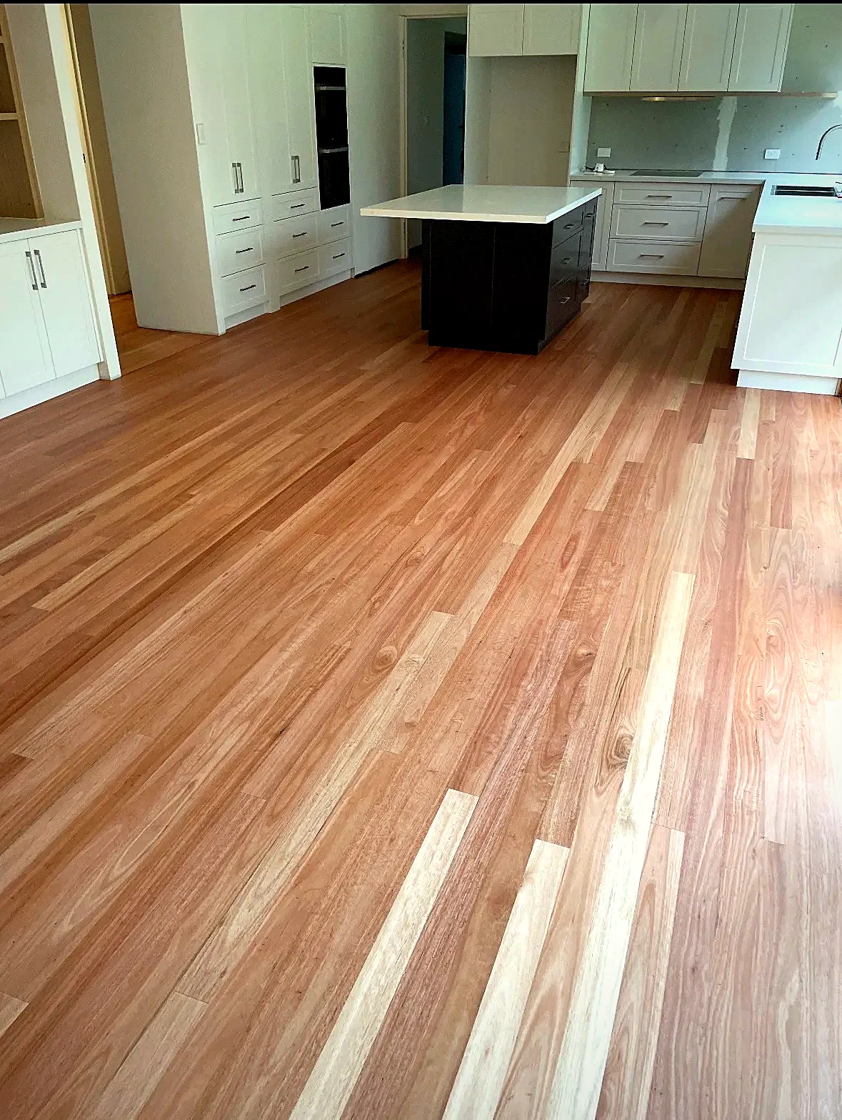 Blackbutt timber floor sanded and polished in a modern kitchen, Central Coast NSW -- Select Timber Flooring