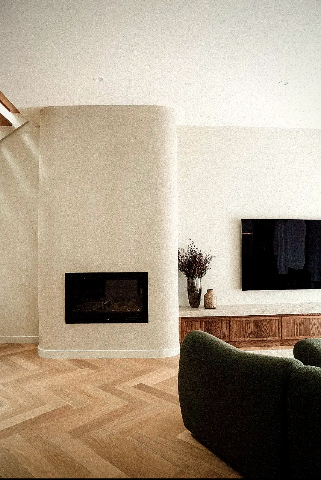 European Oak herringbone parquetry in living room with fireplace, sanded and finished by Select Timber Flooring