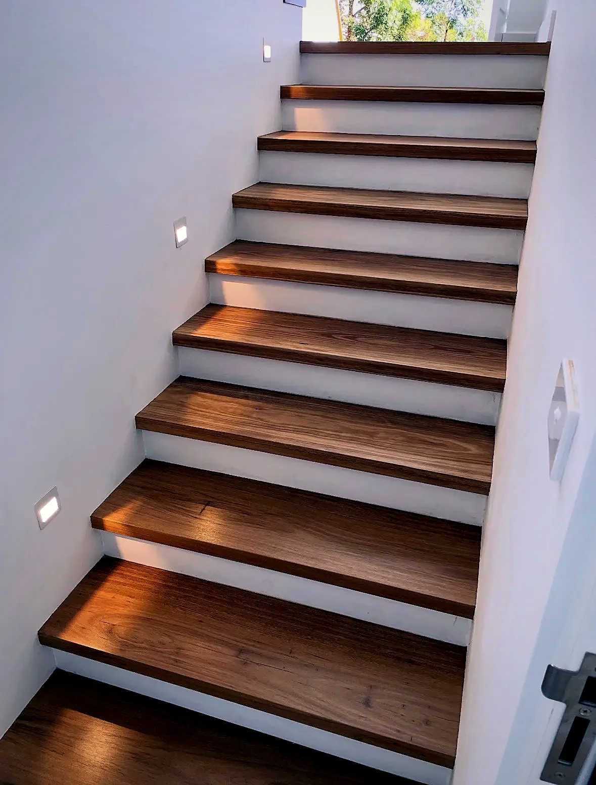 Spotted Gum timber staircase with LED lighting, sanded and polished by Select Timber Flooring